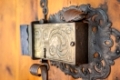 Church portal with old door lock at the parish church of St. Peter in Villnoesstal, South Tyrol, Italy